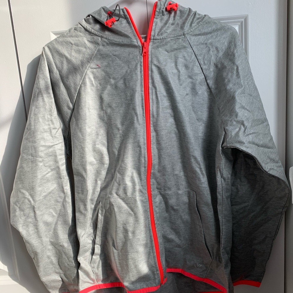Grey windbreaker with neon pink accents